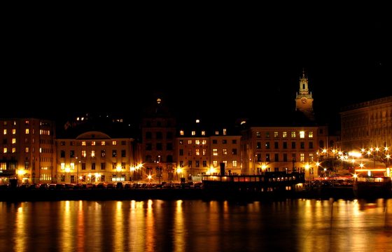 The lit waterfront of Gamla Stan, the medieval old town, at night