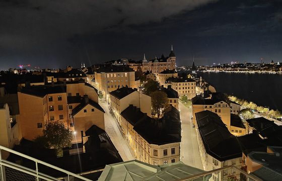 Rooftops of a central Stockholm district above the water at dusk