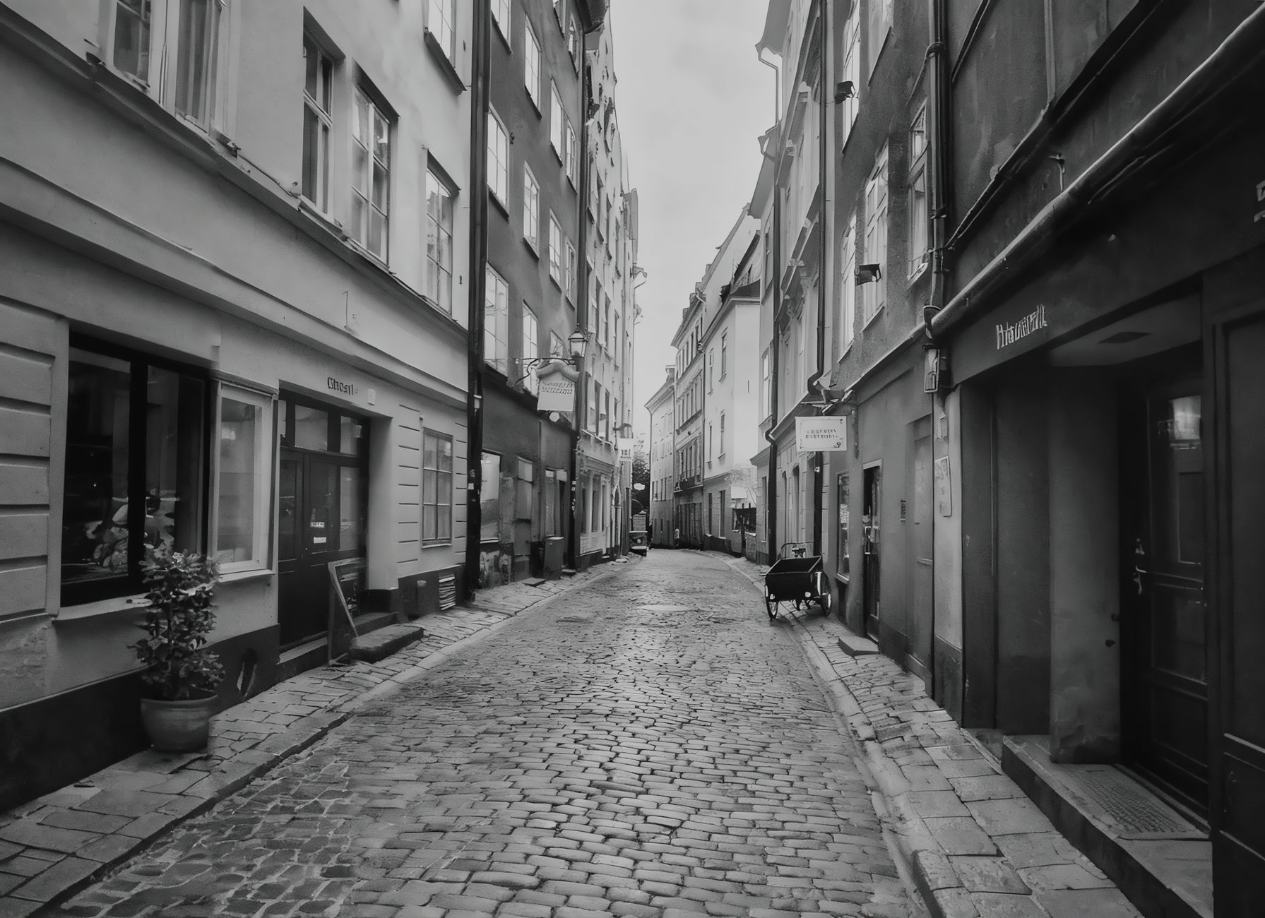 Black and white view of a narrow cobblestone street in Stockholm's historic district. — illustrating How Does Paying Work in Stockholm, and Is Cash Still Used?