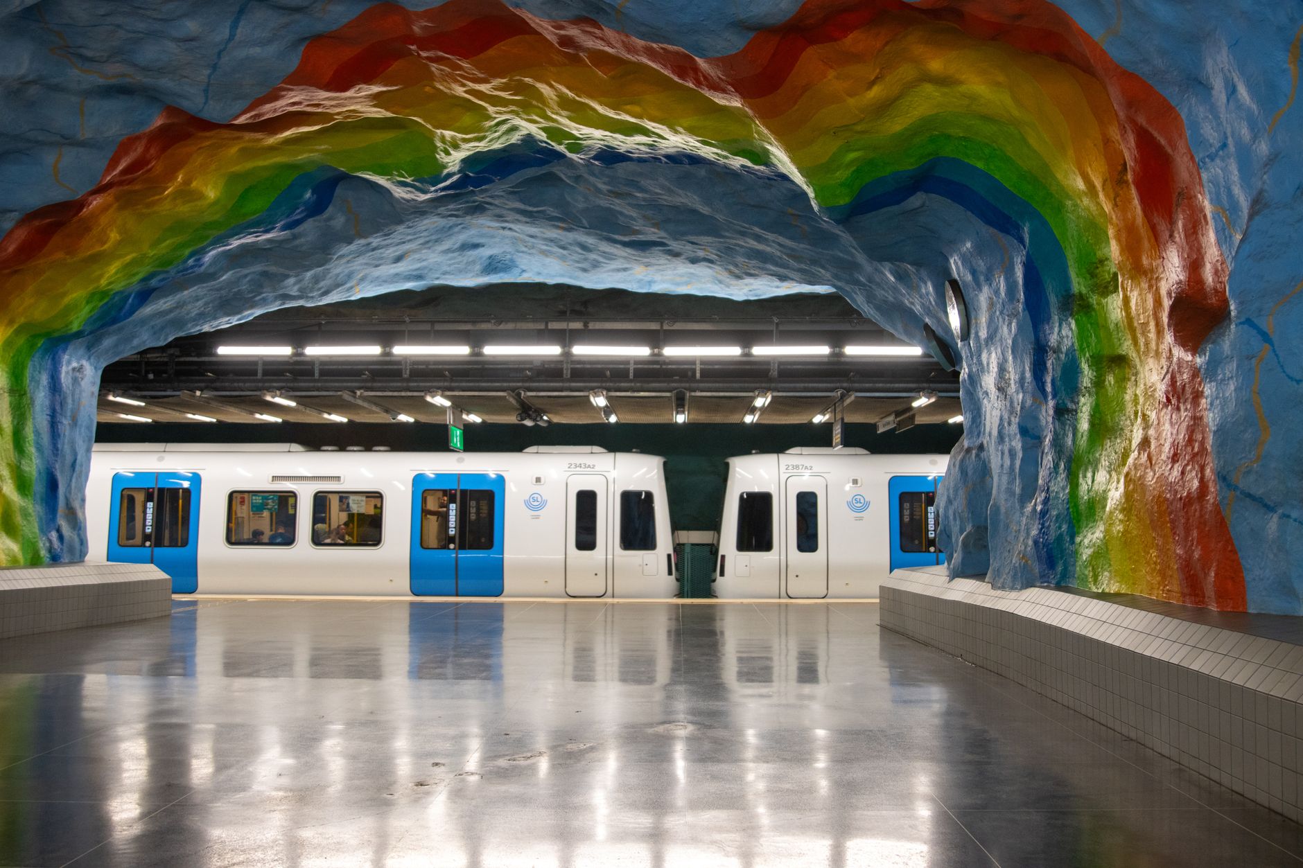 Colorful rainbow art decorates the subway tunnel at a Stockholm metro station in Sweden.