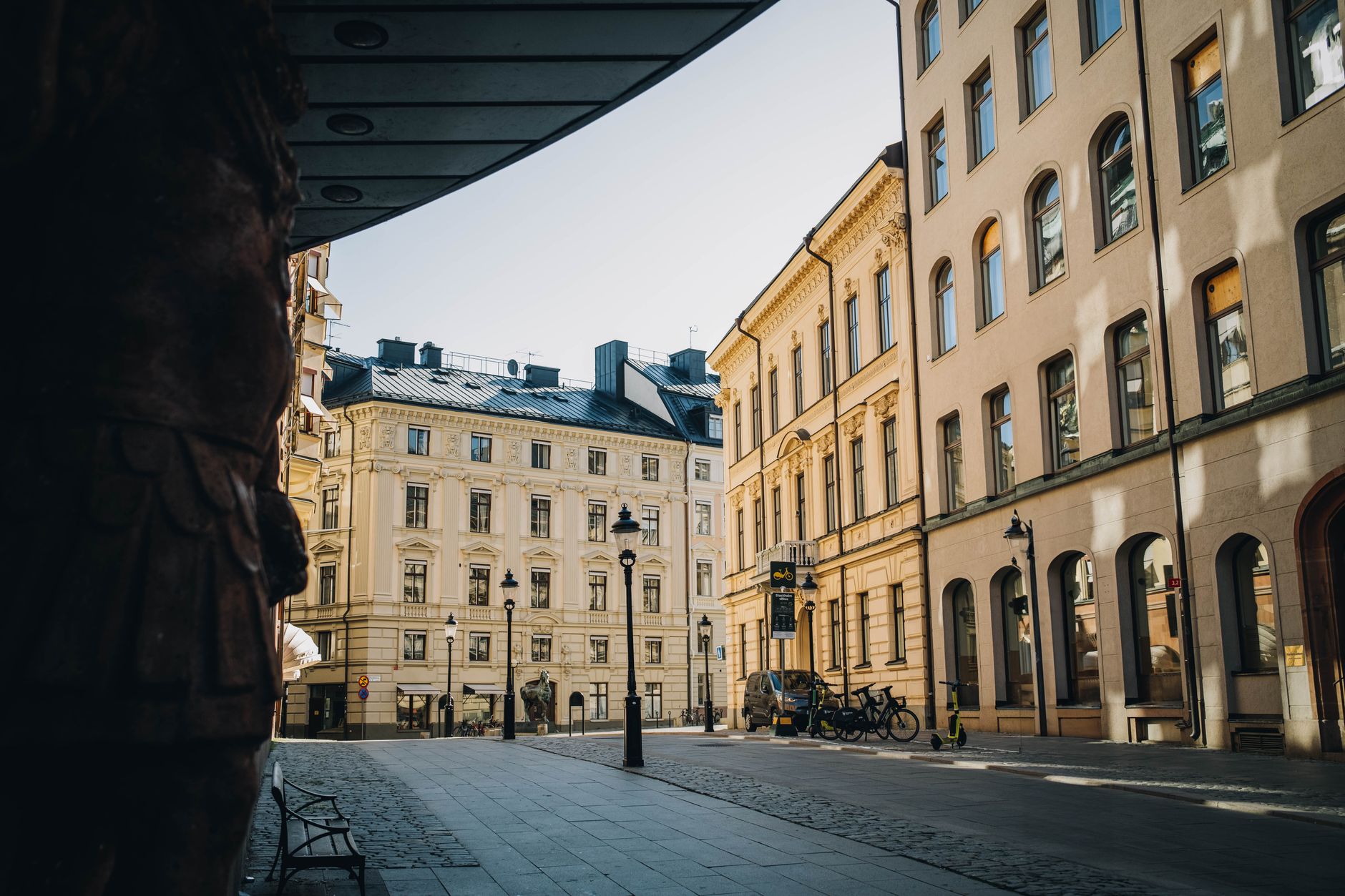 View of a quaint cobblestone street in Stockholm with neoclassical architecture and a tranquil urban ambiance. — illustrating How Does Tipping Work in Sweden? A Practical Guide