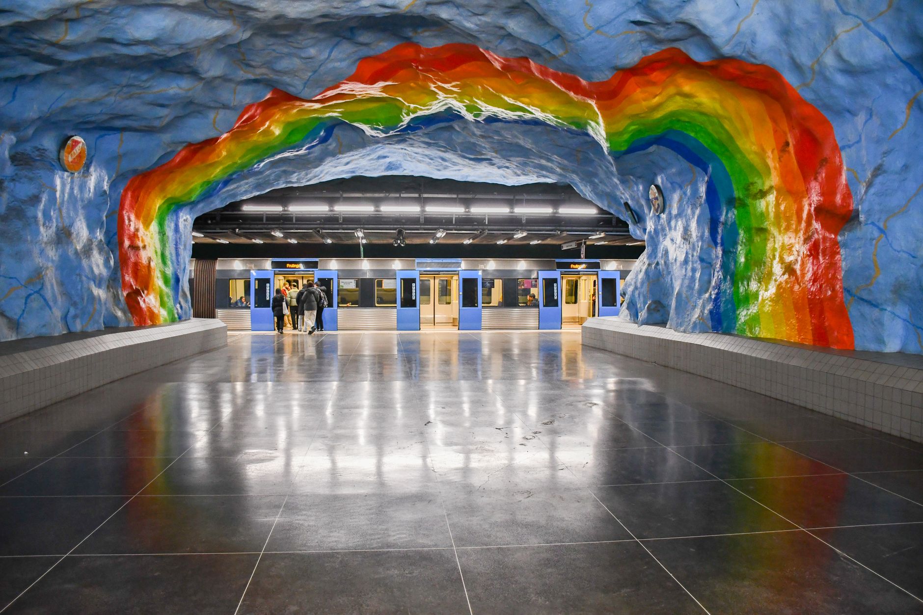 Colorful rainbow mural at a Stockholm metro station reflecting on the floor. — illustrating How Do You Get From Arlanda Into Stockholm City?