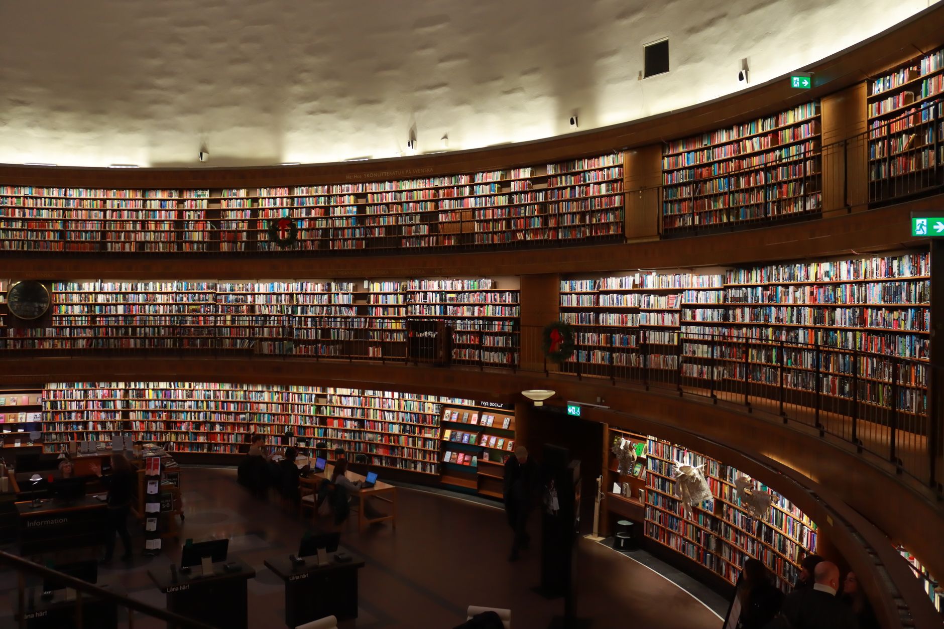 A vast collection of books lining the shelves of Stockholm's iconic public library. — illustrating What Is the Stockholm Public Library, and Why Is It Famous?